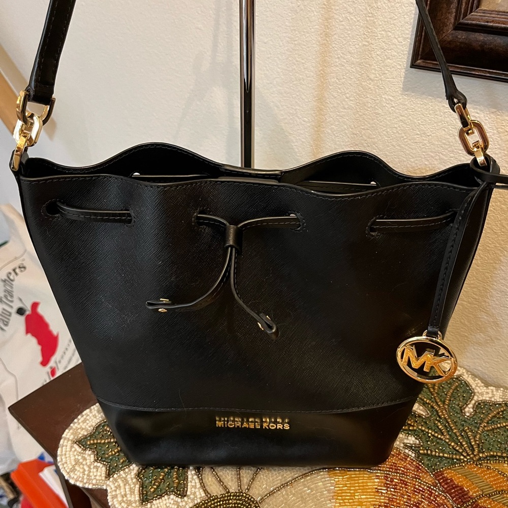 Michael Kors Black Bucket Bag with Drawstring Closure. Gold emblems. NWOT